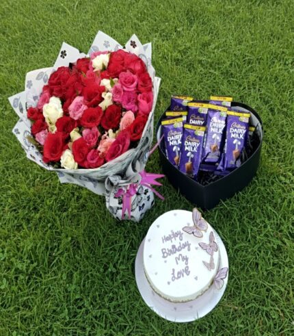 Birthday Surprise Combo with roses bouquet, heart-shaped chocolate box, and custom birthday cake by Timeless Wrap.