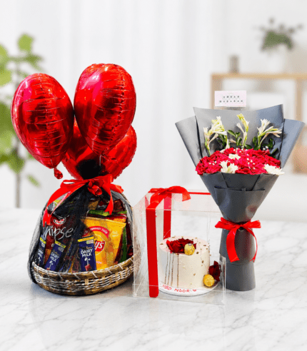 Luxury romantic gift combo featuring a snack basket with red heart balloons, elegant flower bouquet, and designer cake for birthdays, anniversaries, and Valentine's Day.